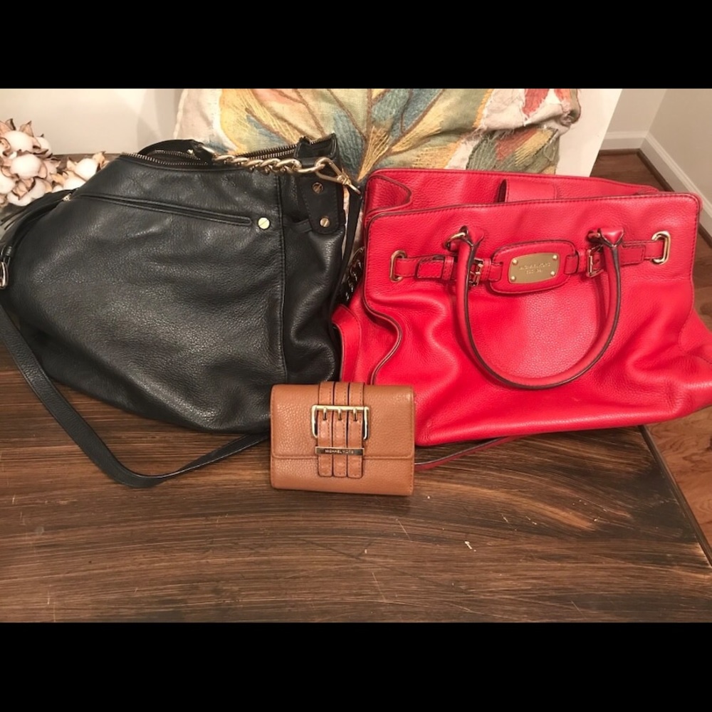 2 Michael Kors purses and 1 Michael Kors wallet